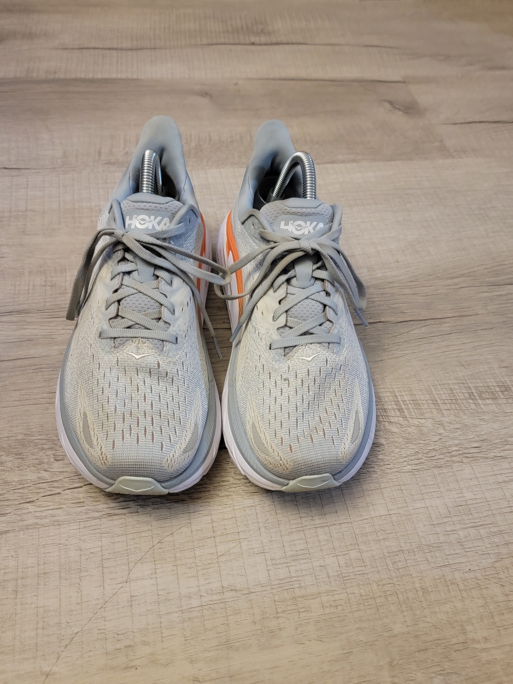 Hoka Neutral Running Shoes in Light Gray with Orange Accent